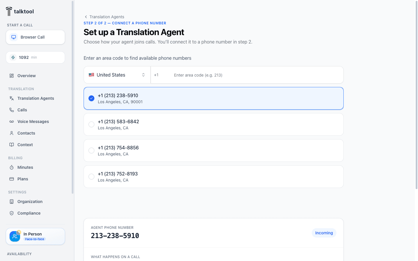 Step 2 of the wizard — searching by area code and selecting an available phone number